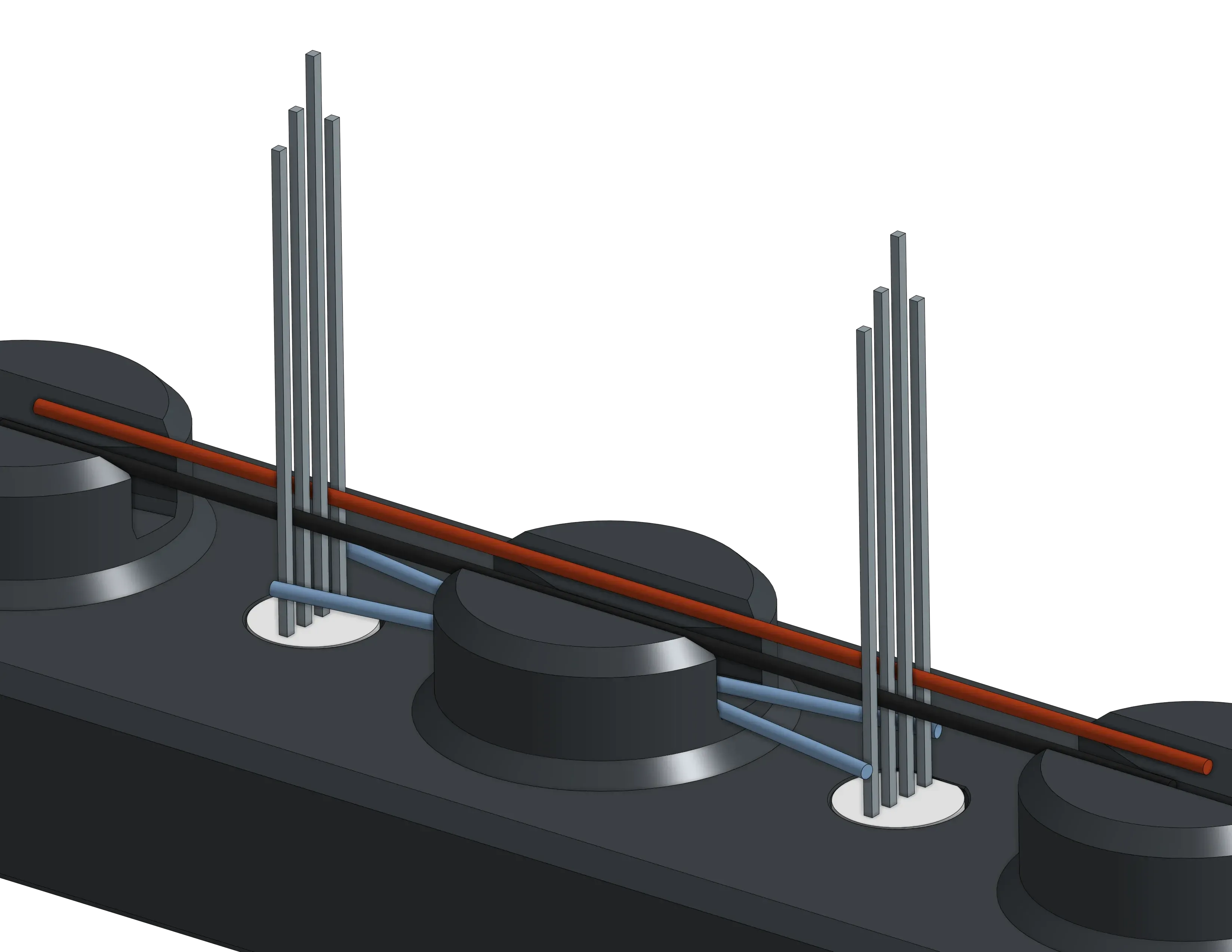 The first jig solders 16 LEDs into a single row, connecting each to power and routing data between them.